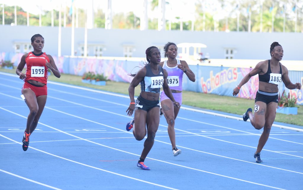 Samantha Henry-Robinson (centre) wins the women's 100m at the Blue Marlin Track and Field Classic at the Thomas A Robinson Stadium on July 10, 2016
