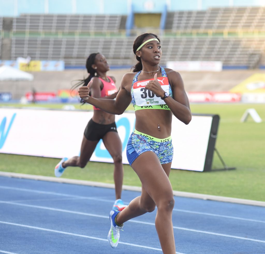 Leah Nugent crosses the finish line first in the heats of the women's 400m hurdles at the Supreme Ventures Jamaica Championships on June 30, 2016
