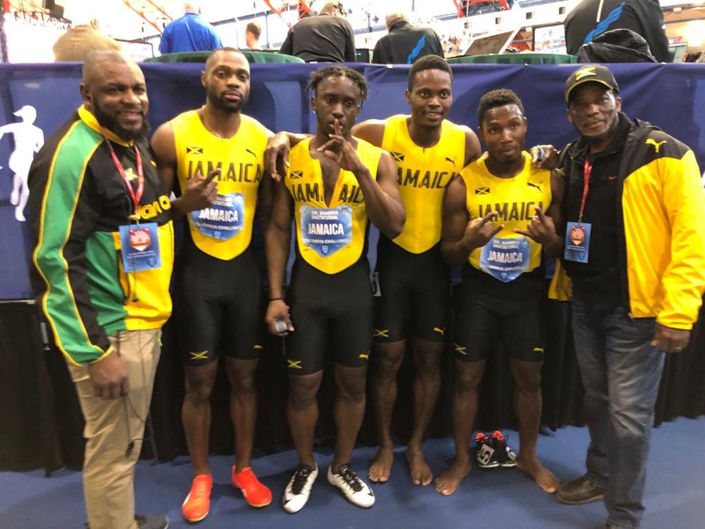 Members of Jamaica's male 4x200m team pose with officials at Dr Sander Invitational 2019