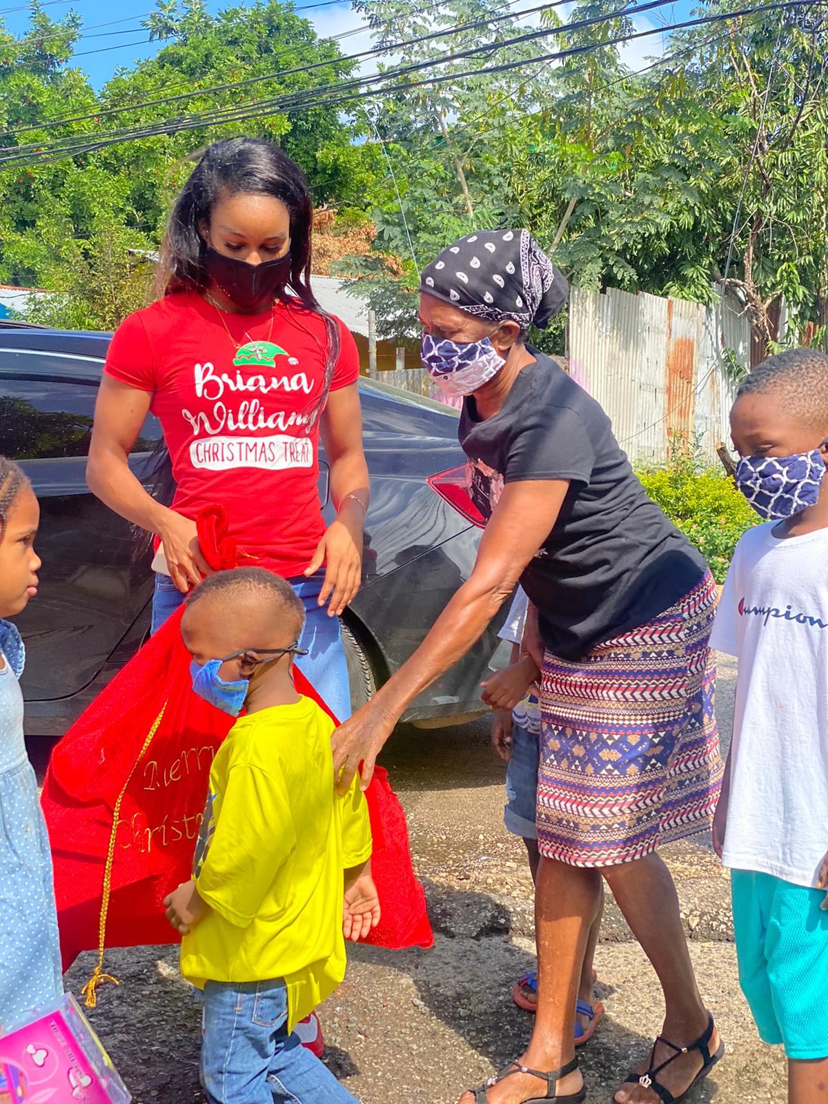 Briana Williams treats kids in Paradise Acres for Christmas