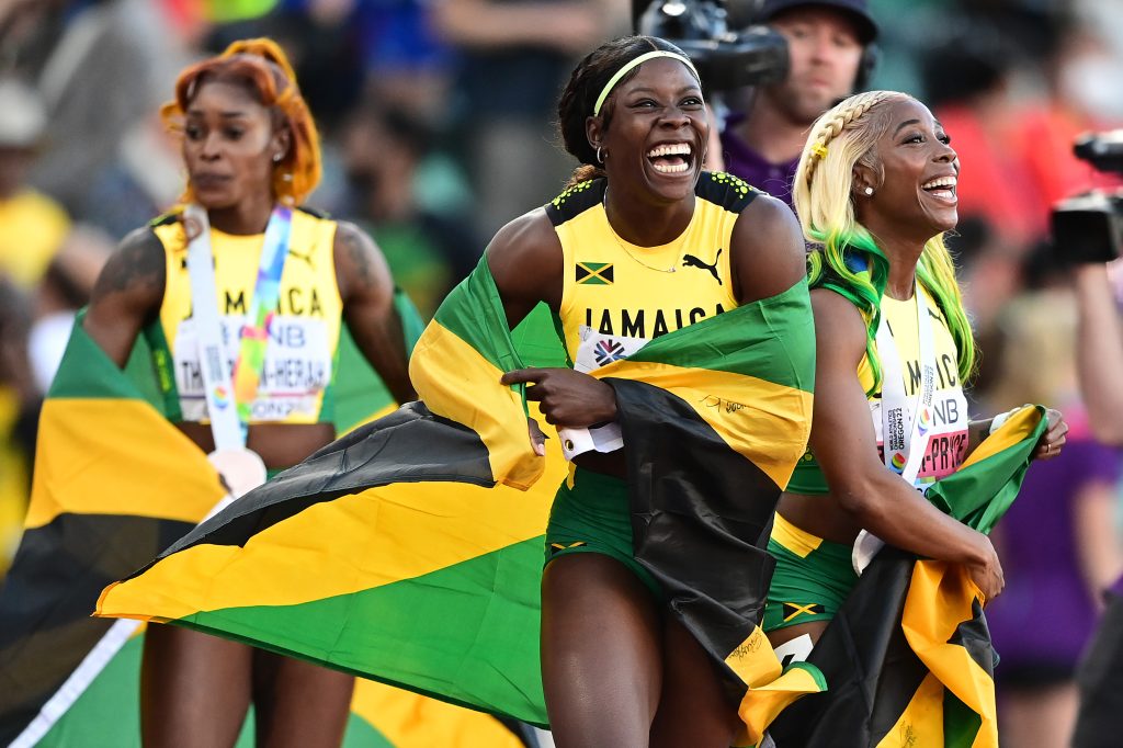 Jamaican athletes, left to right, Elaine Thompson-Herah, Shericka Jackson and Shelly-Ann Fraser-Pryce celebrate their 1-2-3 finish in the women's 100m final at Oregon22 World Athletics Championships 