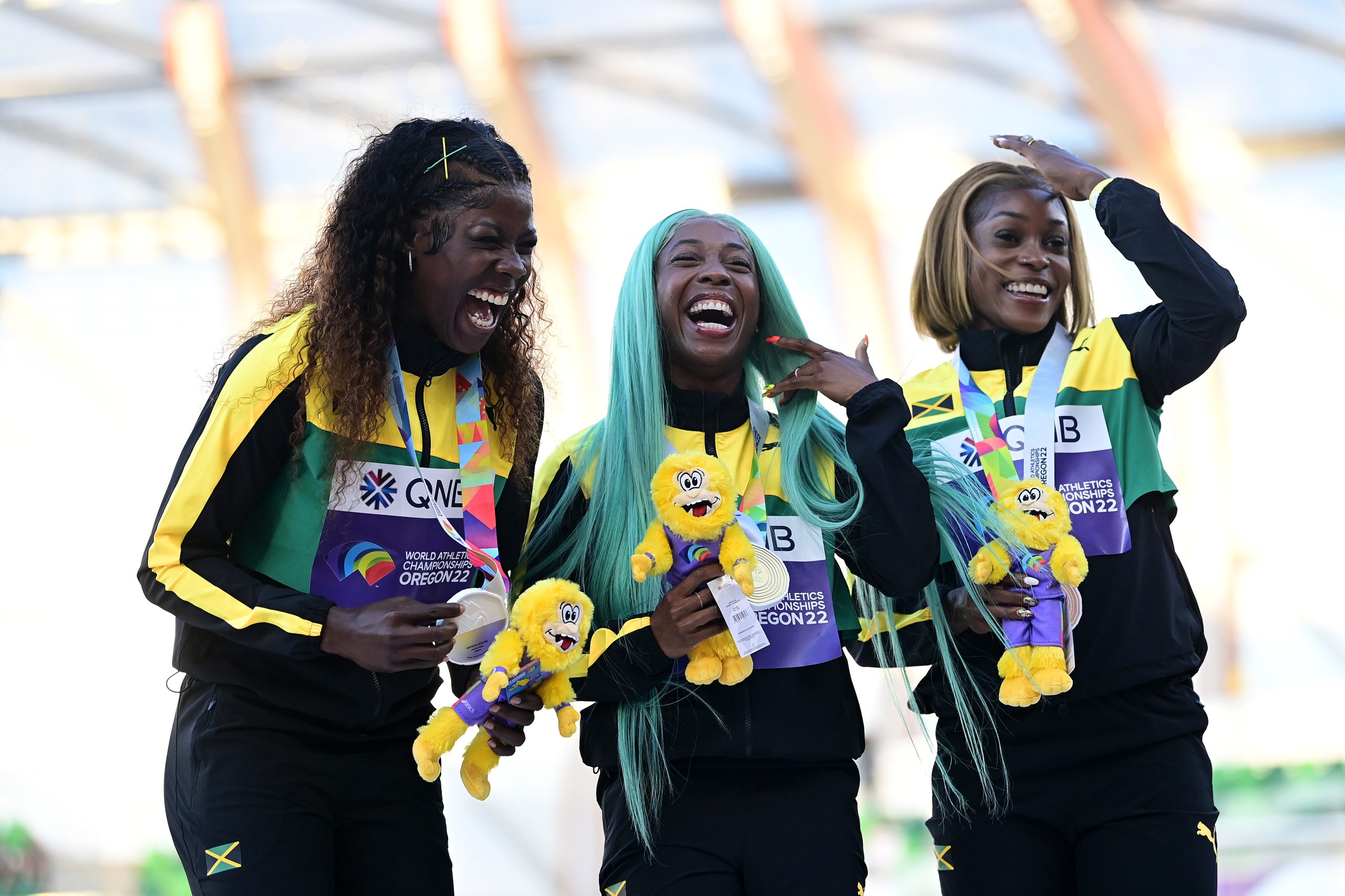Silver medalist Shericka Jackson of Team Jamaica, gold medalist Shelly-Ann Fraser-Pryce of Team Jamaica and bronze medalist Elaine Thompson-Herah of Team Jamaica pose during the medal ceremony for the Women's 100m Final on day four of the World Athletics Championships Oregon22