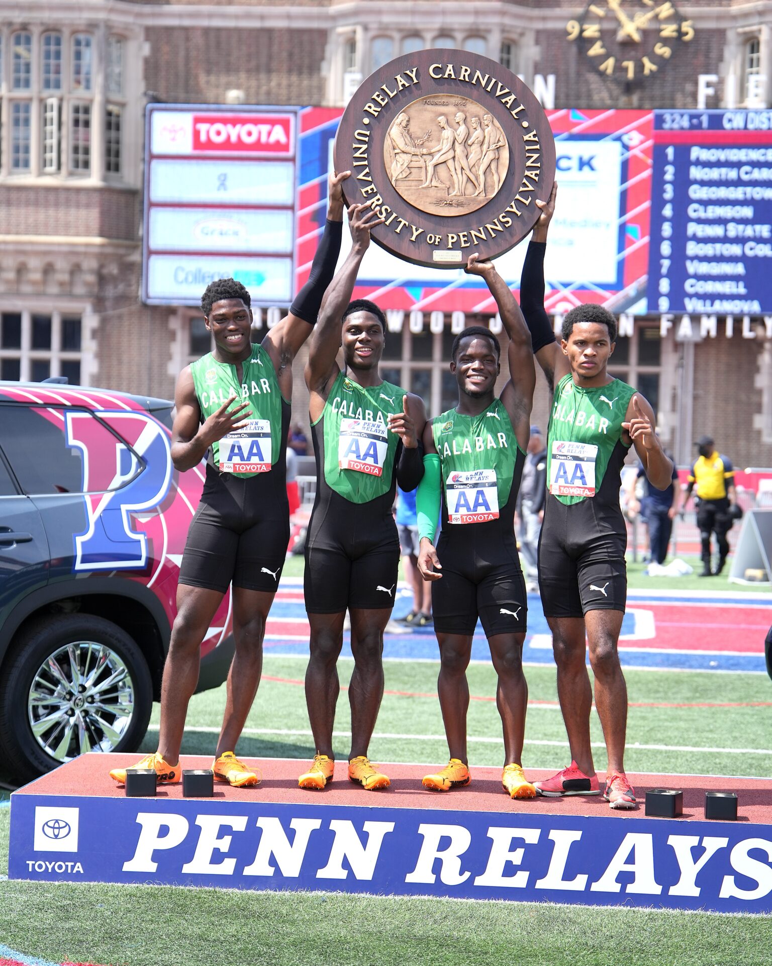 Shaquane Gordon, Khamani Gordon, Jamal Stephenson, and Dijon Swaine, celebrate Calabar’s record-tying 9th Penn Relays Championship of America 4x100m title after clocking 39.79 seconds—the 8th fastest in meet history at Penn Relays.