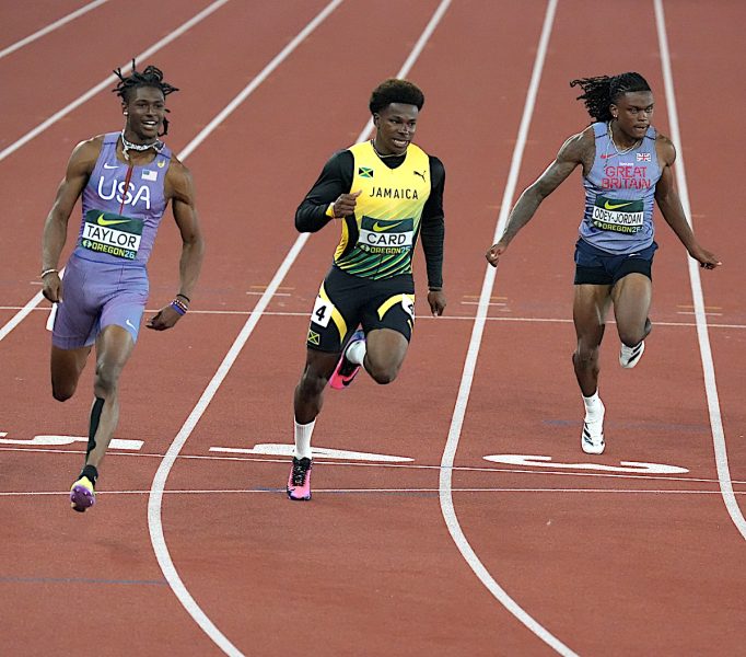 Jamaica’s Gary Card races to silver in the men’s 100m final, clocking 10.05 seconds behind American Tate Taylor, who won in a personal-best 9.94 at Hayward Field.
